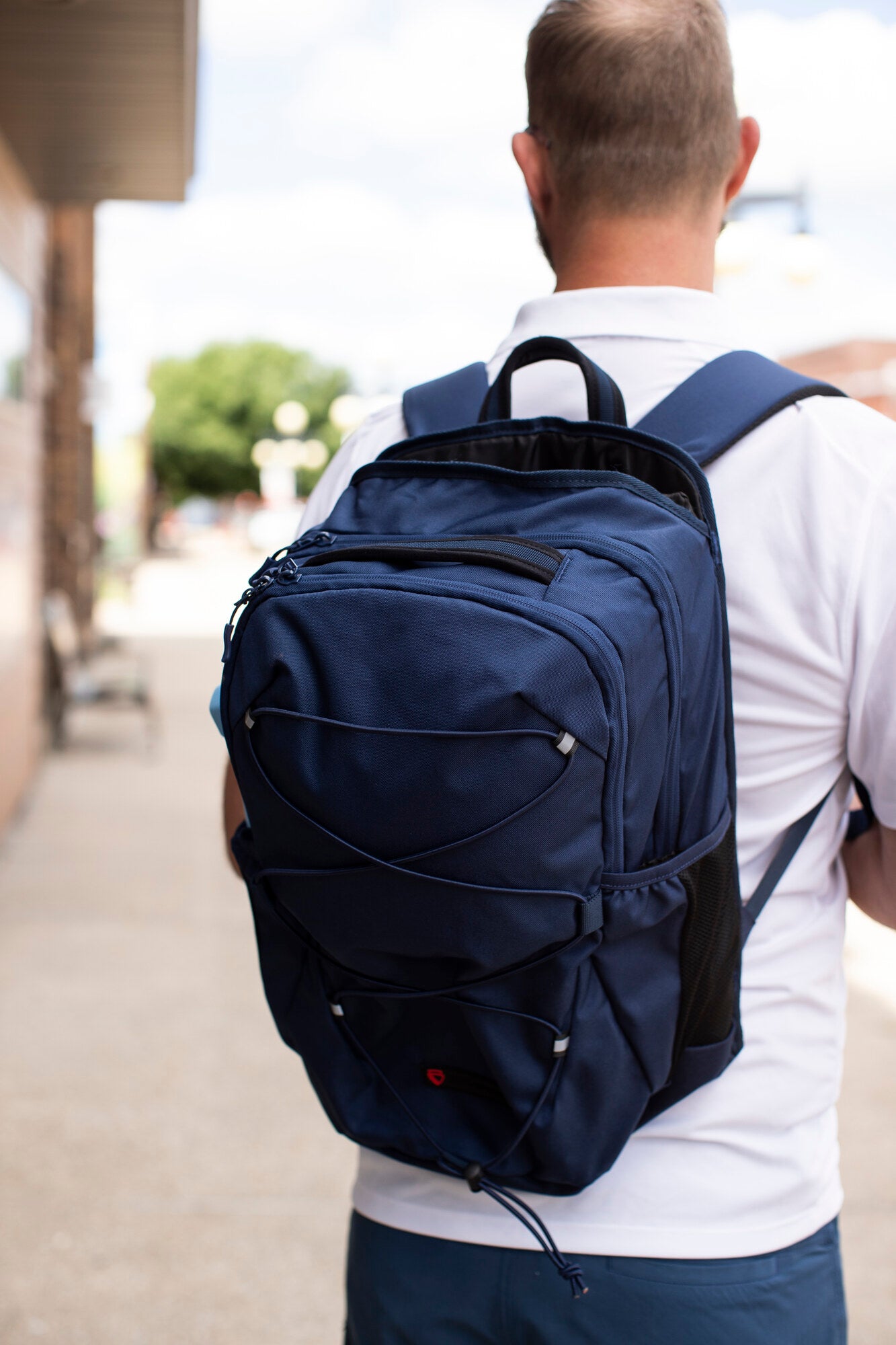 Adult wearing a BP Defence bullet-resistant backpack