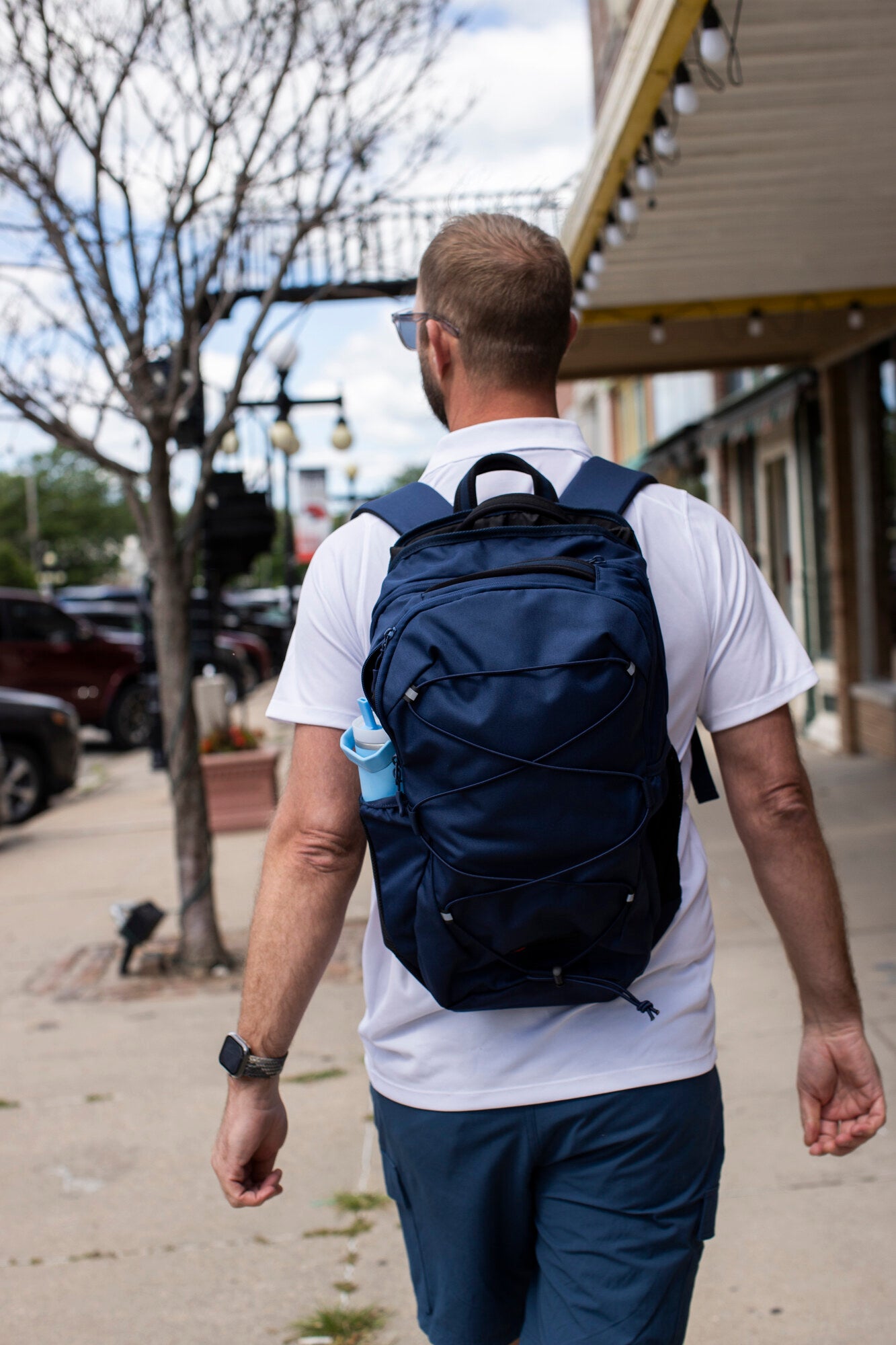 Adult wearing a BP Defence bullet-resistant backpack
